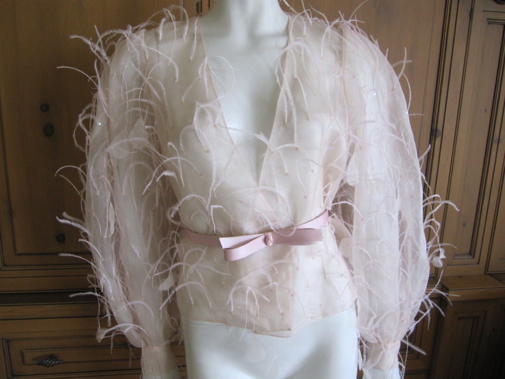 Oscar de la Renta dreamy sheer silk ostrich feather belted jacket.
Pale blush pink with sequin  and  ostrich feather detailing.
Comes with a matching OdlR belt
