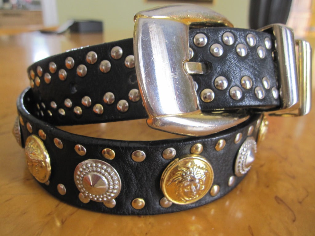 Gianni Versace 1992 Men's Medusa studded belt.
Two tone, gold and  silver on black leather.
This belt is featured numerous times in the Versace Fall 1992 book, photographed by Bruce Weber
Marked 75/30
fit's 28
