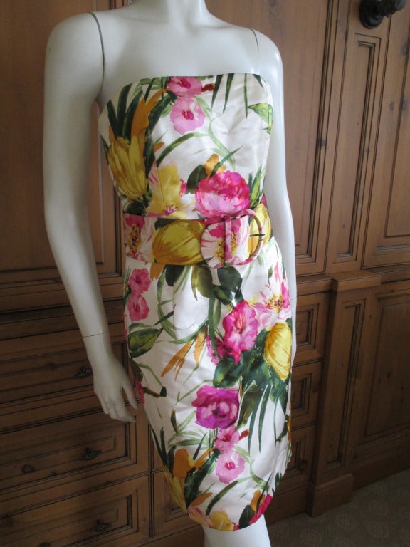 Oscar de la Renta strapless floral dress with sheer silk coat.
This is such a beautiful ensemble.
Silk dress with built in bustier, Matching floral pattern sheer silk coat, and a leather trimmed silk belt.