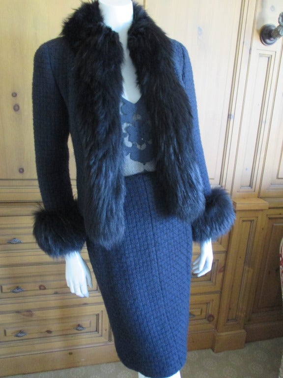 Chanel fox trimmed three piece navy boucle suit 
From Fall 2000
Consisting of a skirt, cashmere top and fox trimmed jacket