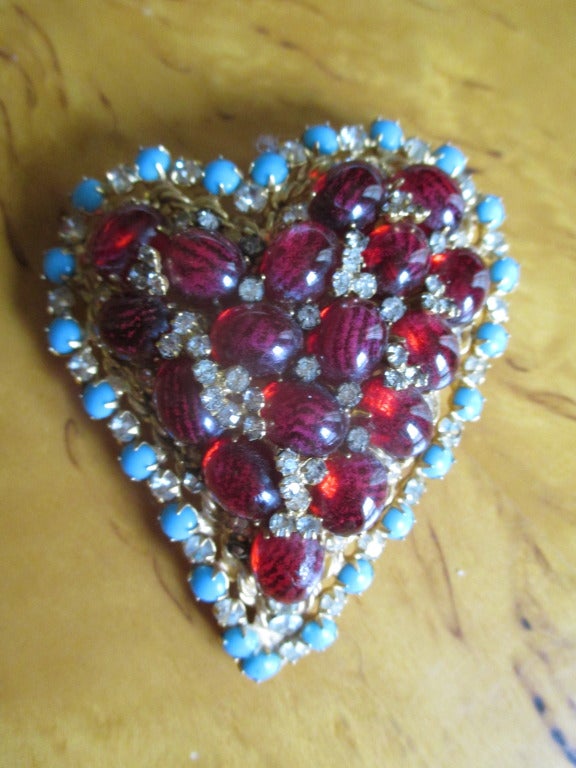Arnold Scaasi Bold Heart Pin with Ruby Cabachon and Turquoise
Measures 2 3/4