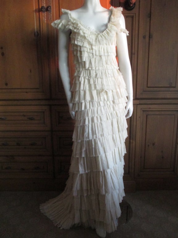 Lanvin by Alber Elbaz One Off Wedding Dress Spring 2004
a soft gauzelike tulle ruffled and layered with unfinished edges.
This is exquisite.
No size tag, going from measurements it is about sz 6
There is a train, the front measures 55
