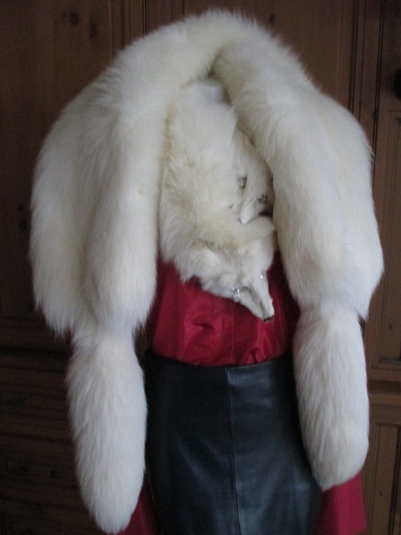 Christian Dior Haute Couture Pair of Arctic Fox Wraps.
The fox heads are still attached and are embellished with Swarovski crystal eyes..
Both have Dior Labels.
Each has large fur clip on the heads
58
