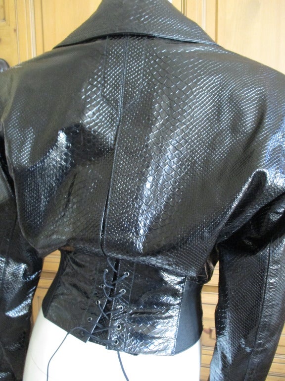 Azzedine Alaia 1980's Python Embossed Patent Leather Jacket with Corset Lace Back

 sz 38

BUST:  40