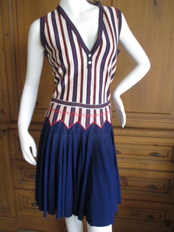 Alaia Knit Striped Top with Matching Navy Skater Skirt
Top
Bust: 36 in.
Waist: 30 in.
Length: 23 in.

Skirt
Waist: 27 in.
Length: 20 in.