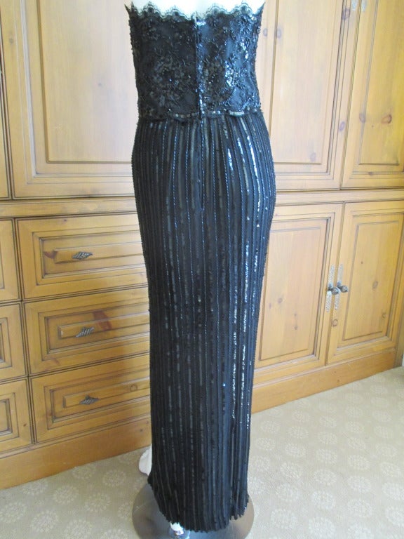 Jean-Louis Couture Custom 1959 Column Gown.
Exquisite strapless dress with boned bodice. Embellished with sequins and beads sewn on netting over silk.
Jean-Louis was a brilliant Hollywood designer with a long and storied career. His most famous