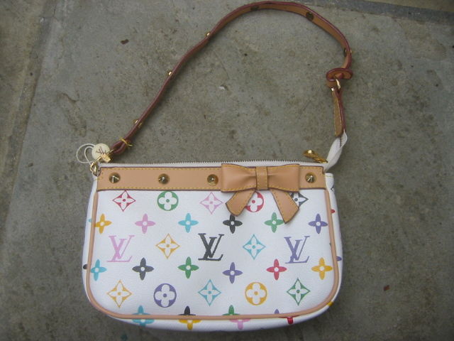 Darling small multicolor monogram clutch / bag from Louis Vuitton.<br />
<br />
Detachable strap, lined in soft buff suede.<br />
<br />
Although it appears to have been used, it still has the tag, and the wrapping on the inside pouch zipper.<br