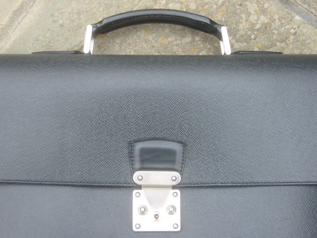 Elegant never used Tiaga Briefcase in Black from Louis Vuitton<br />
<br />
This is the current model, and retails for $2630, if you can locate one<br />
<br />
This elegant and functional Robusto case in Taiga leather offers two large