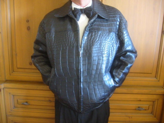Luxurious Matte Black Genuine Alligator Jacket.<br />
Zip front with two pockets.<br />
This is an astonishing piece, incredibly luxurious .<br />
The original retail was $20,000, and it is unworn.<br />
Sz 42<br />
chest 52