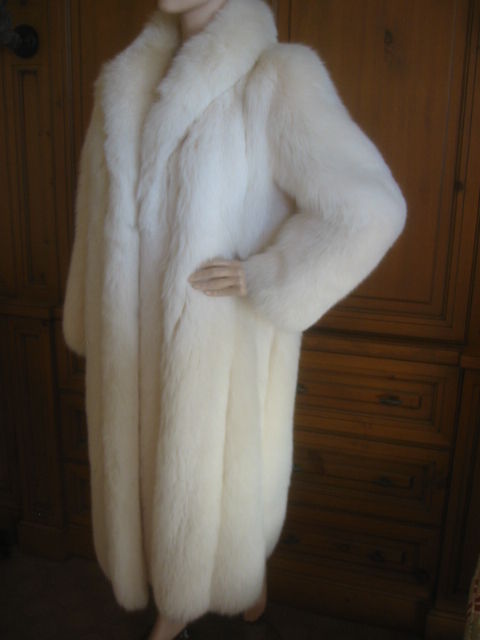 Luxurious Artic white full length fox coat from Revillon for Saks Fifth Avenue.<br />
It is in perfect, excellent condition, and was just cleaned at the Bergdorf Goodman Fur Salon.<br />
Heavy fur hooks from collar to hem.Two velvet lined slit