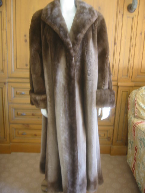 Luxurious sheared beaver full length coat , from Neiman MArcus.<br />
It is a muted green, with an ombre effect.<br />
In excellent condition.<br />
Bust 44