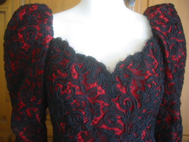 This is the quintessential Yves Saint Laurent Haute Couture Evening Gown.<br />
<br />
The bodice features a flattering princess silhouette with full leg-o-mutton sleeves which gradually taper to the wrist, and fasten with a short zipper. The