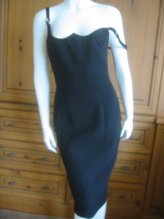 Elegantly sculptural little black dress from Atelier Versace.<br />
This is a timeless classic, with an unusual bustline, and a beautifully cut back.<br />
There is an inner zippered layer, with some minimal boning.<br />
Custom made for a