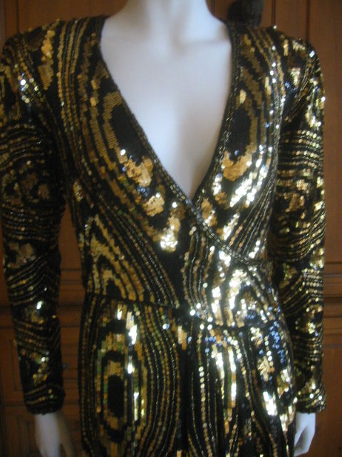 Seductive VIntage 70's sequin dress from Halston.<br />
It is a wrap style, and will fit a sz 2-6.<br />
It is not easy to measure wrap dresses as there is so much variation depending where you tie the wrap.<br />
Appx measurements <br />
Bust