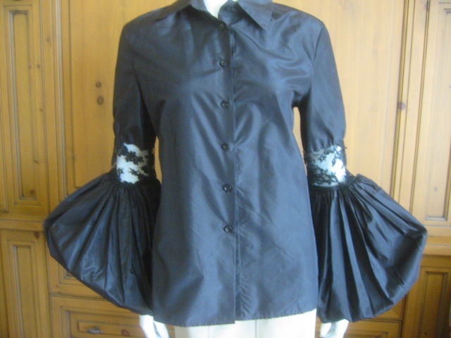 Dramatic Monique Lhuillier Black Silk and Lace Poets Blouse<br />
Silk , with lace inserts and on the bold sleeve<br />
Bust 48