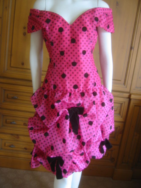 Arnold Scaasi Polka Dot Off the shoulder cocktail dress.<br />
This is a great treasure from the 80's, very exuberant with polkadot silk , with black bows.<br />
sz 8<br />
Bust 36