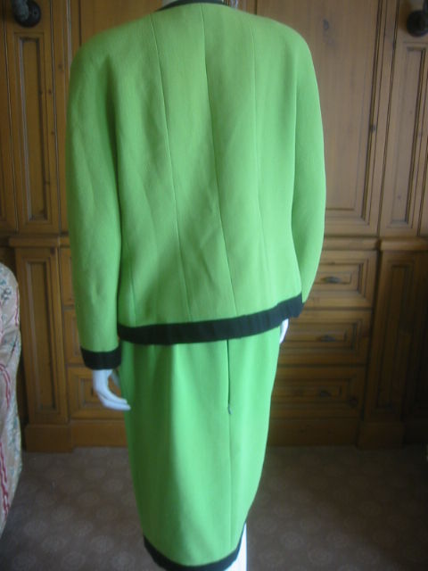 Women's Chanel charming vintage neon green suit with black trim 42