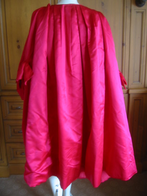 Dramatic Fucia Silk Opera Coat/Cape with bracelet length sleeves adorned with large bows.<br />
This is a great piece, and is ample in size, probably a Large.<br />
<br />
I also styled it with a Sable Collar.<br />
It is not original to the