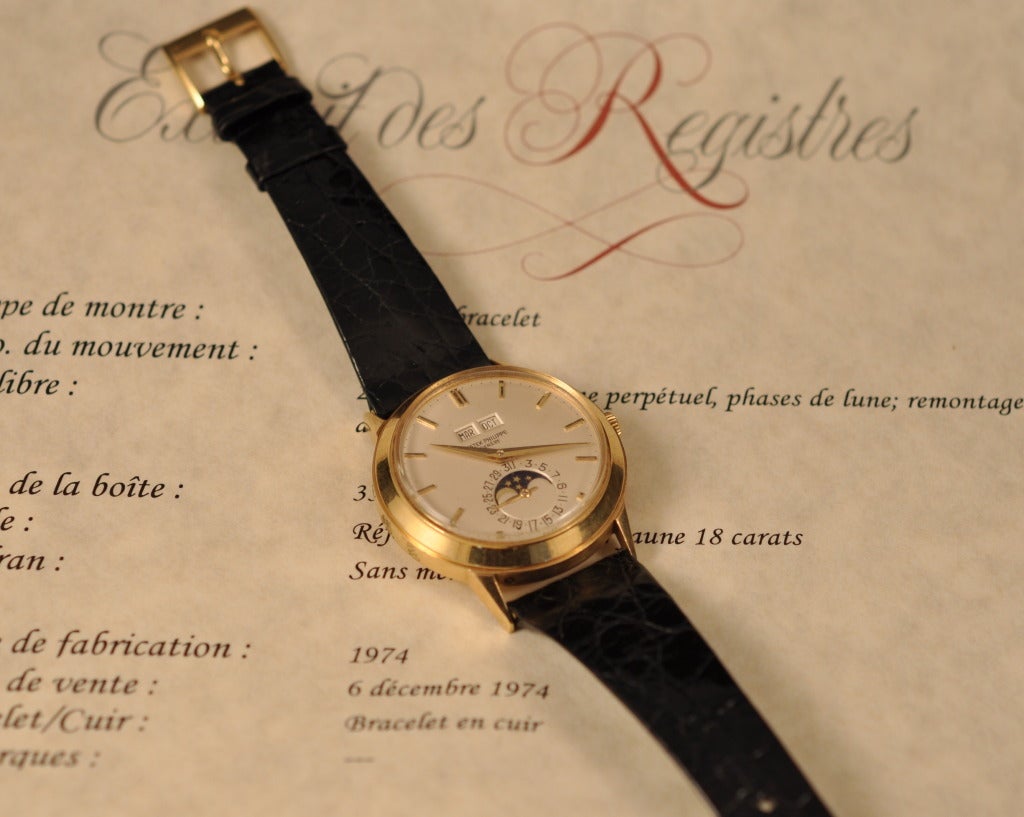 A fine and very rare Patek Philippe 18k yellow gold perpetual calendar automatic wristwatch with day, date, month and moonphases. With Patek Philippe Extract from the Archives.