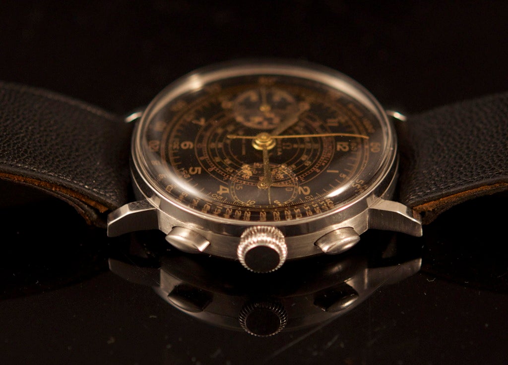 Fine Omega stainless steel chronograph wristwatch with a rare gilt black dial, manual-wind movement.