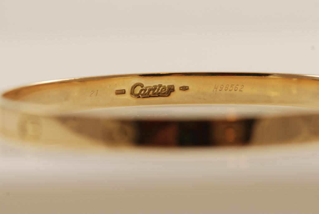 18k gold Love bracelet by Cartier. Opens with a small screw.
Size 21cm (circumference) which is the largest size made by Cartier.