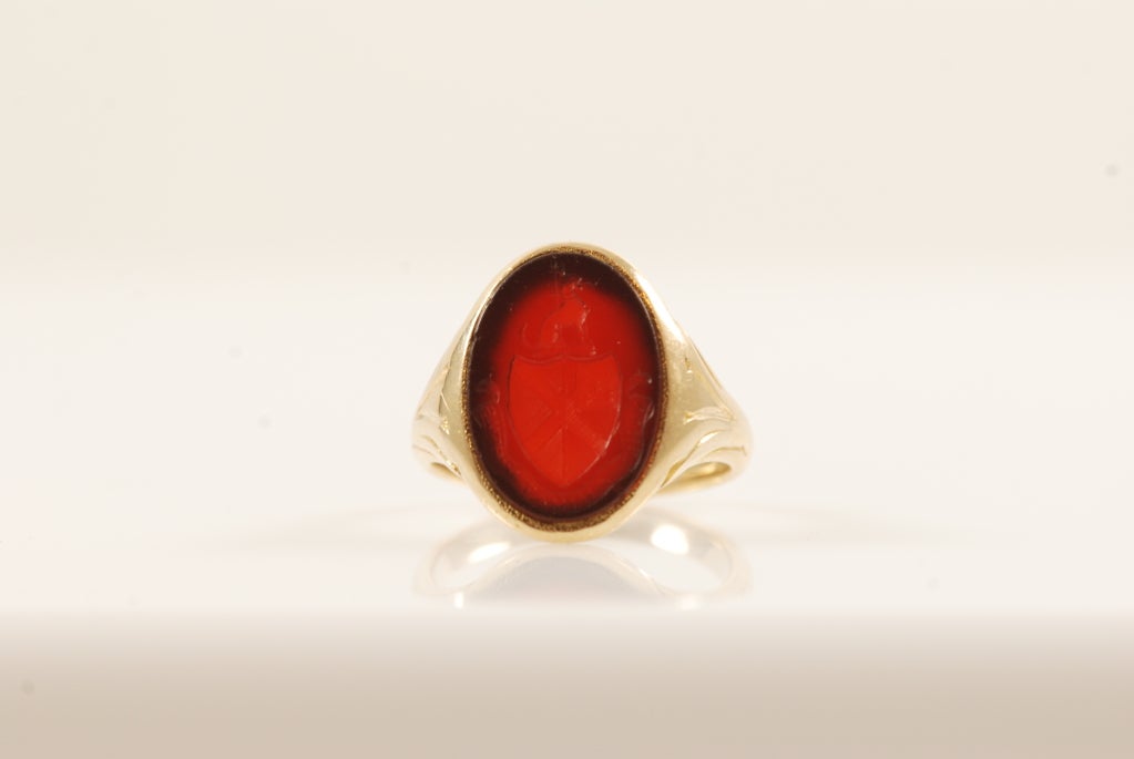 Tiffany & Co. antique signet ring. Shank of the ring is 14k yellow gold and the stone is carnelian. It has a carved crest on the top of the ring. The ring is about a size 6.5-7.0 and can be sized.