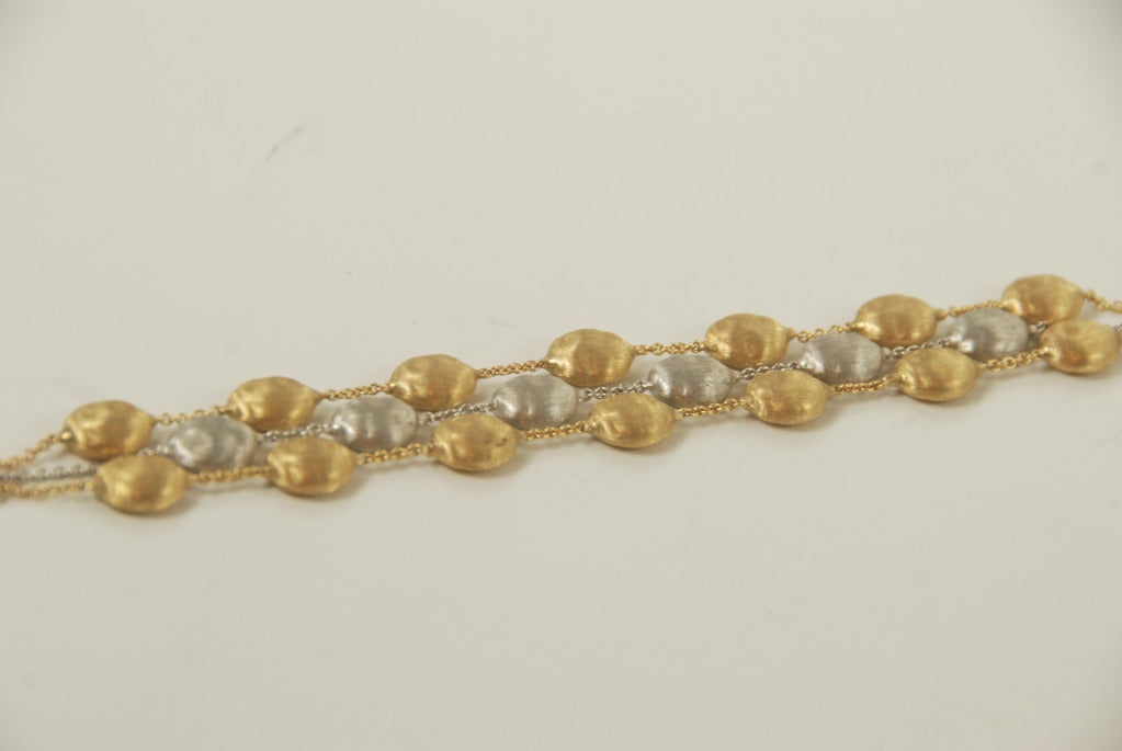 Three strand 18k white and yellow gold Marco Bicego braclet