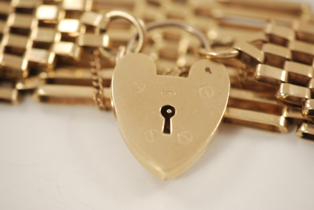 Gate link bracelet, made in England with a heart lock clasp in 9k gold.