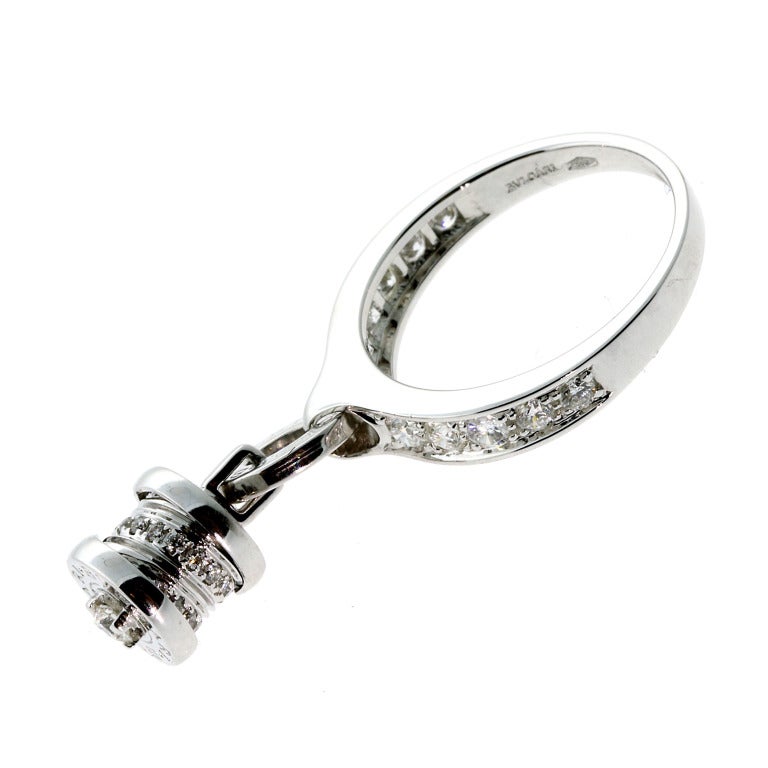 This stunning Bulgari ring is from the B.Zero1 collection, the front of the ring charm which freely moves as its worn. The charm measures 9mm Wide by 19mm in Length, and is covered in pave set diamonds. The ring is a size 6 3/4, and is brand