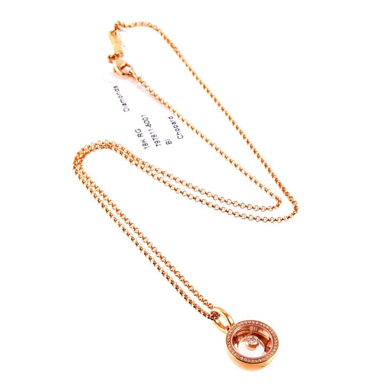 Fabulous Chopard Happy Diamonds necklace crafted in 18k Rose Gold, featuring 40 Round Brilliant Cut Diamonds weighing .16ct. The pendant measures 13mm Wide (.51