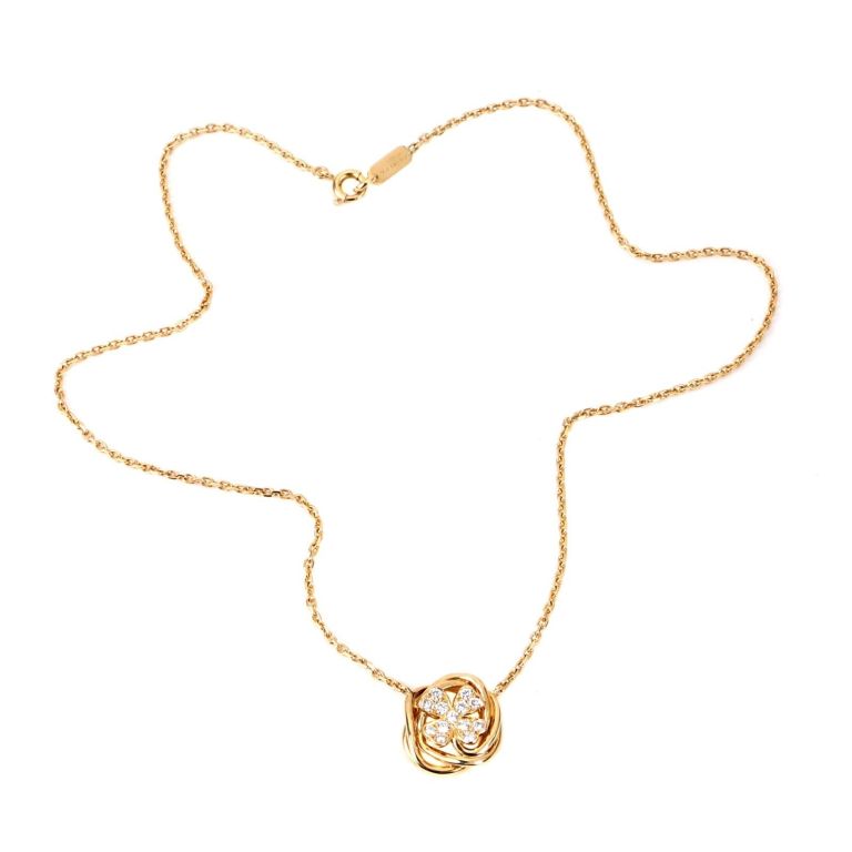 Stunning Chanel Clover Necklace crafted out of 18k Yellow Gold featuring 13 VVS1, E Color Round Brilliant Cut Diamonds, The central motif measures 15mm Wide (.59 Inches) by 15.5mm (.61 Inches) in Length. The necklace has a weight of 8.2 grams, and a