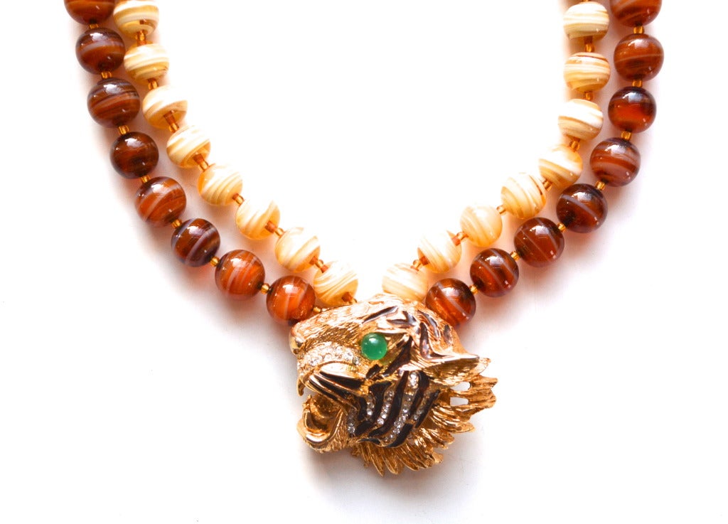 Valentino tiger necklace with beautiful glass beads made to look like agate. Signed Valentino, made in Italy. The quality of construction is evident.  Condition is strong and excellent.  Tiger pendant is about 1.5