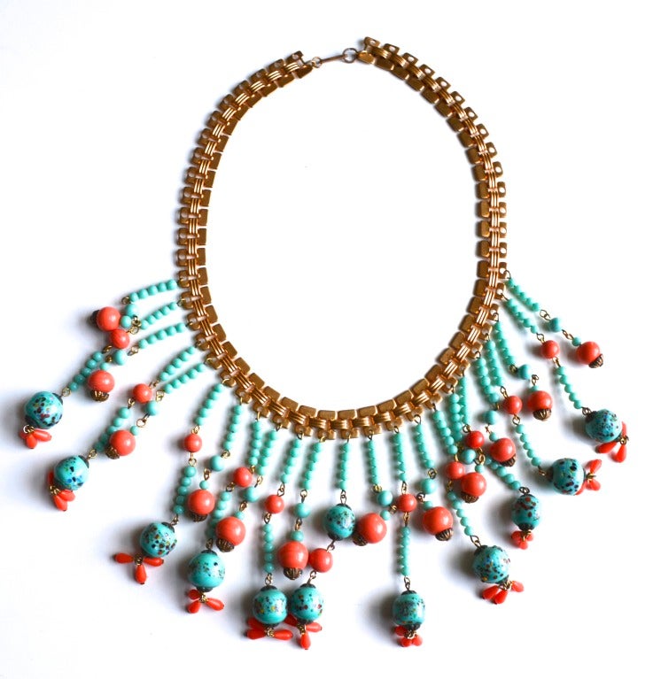 Lovely Turquoise and coral glass beads grace the bottom of this Haskell book chain necklace.  The colors are magnificent and the piece is very good condition.  Signed Miriam Haskell on the clasp.  Circa 1960s-70s, possibly Larry Vrba design.   Glass