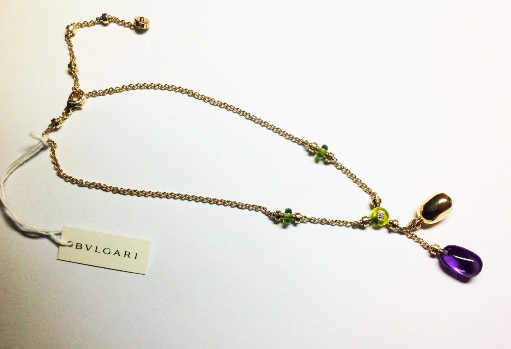 Bulgari  Sassi 18 k yellow gold necklace with amethyst, peridot beads and pave' diamonds.