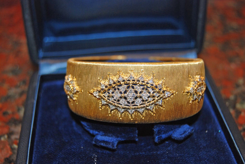 Wonderful 18K Yellow Gold Buccellati Bracelet. Three Diamond Designs  containing 68 round diamonds with a total weight of 1.30 carats.Weight is 52 grams  Size is 73/4
