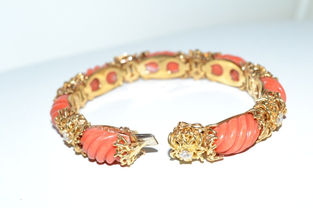 1960 's Tiffany coral  and yellow gold bracelet finished with  7 diamonds  all around of  circa  0.10 carats each.