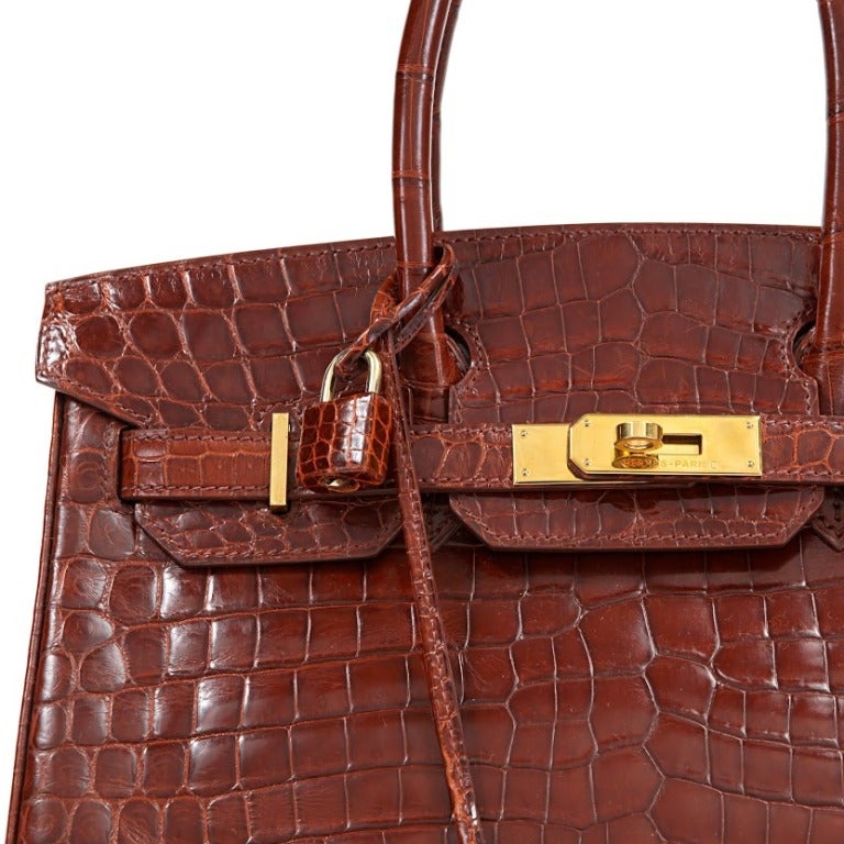 One 2003 Hermes Cognac Crocodile Birkin Bag with Gold Hardware. This bag is 30cm.