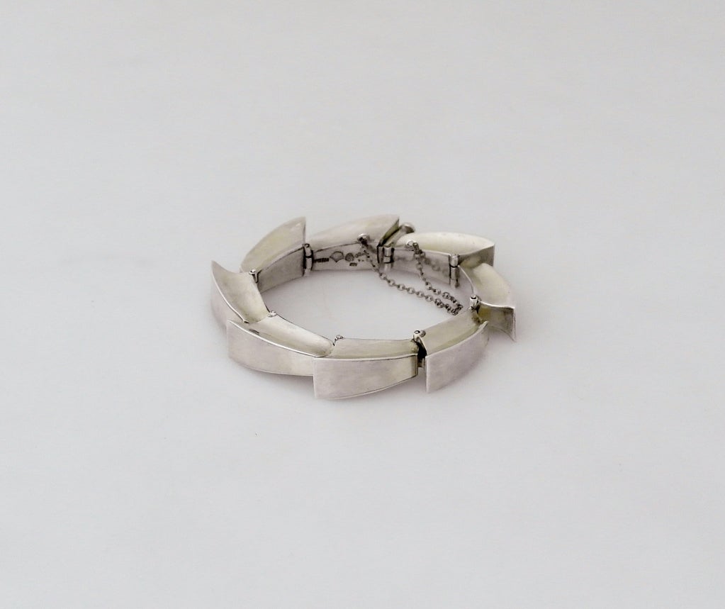 Being offered is a circa 1958 sterling silver bracelet by Antonio Pineda of Taxco, Mexico, the master of silver and modernist design.  The bracelet speaks for itself.  Good weight.
The bracelet measures 2 1/4