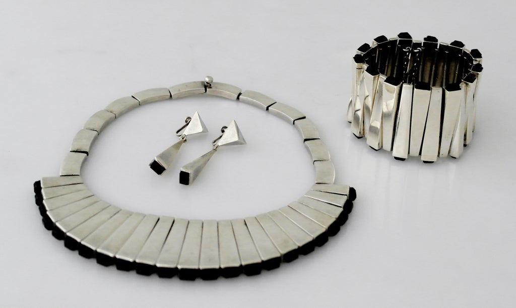 Being offered is a circa 1950 sterling silver necklace, bracelet & earrings set by Antonio Pineda of Taxco, Mexico.

For sale is the most iconic and breathtaking matching set of jewelry from the golden Taxco period in Mexico created by the