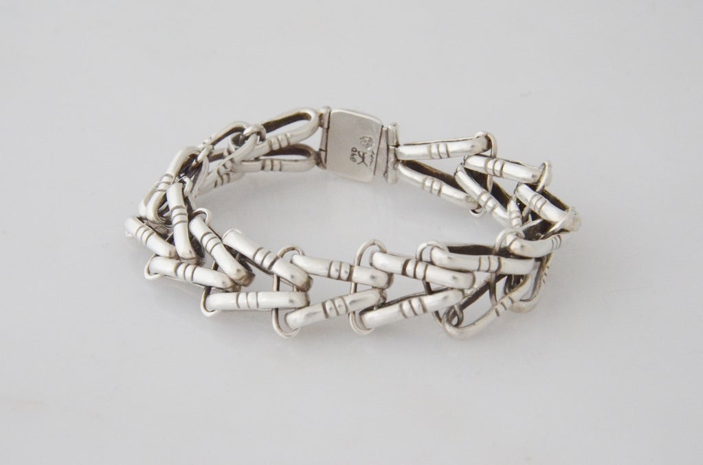 Being offered is a circa 1950 sterling silver bracelet by Hector Aguilar, of Taxco, Mexico,