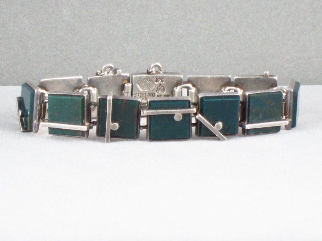 Being offered is a circa 1950's .970 silver and green bloodstone bracelet designed and signed by artist Antonio PIneda, of Taxco, Mexico of modernistic and geometric design.  Measuring 7