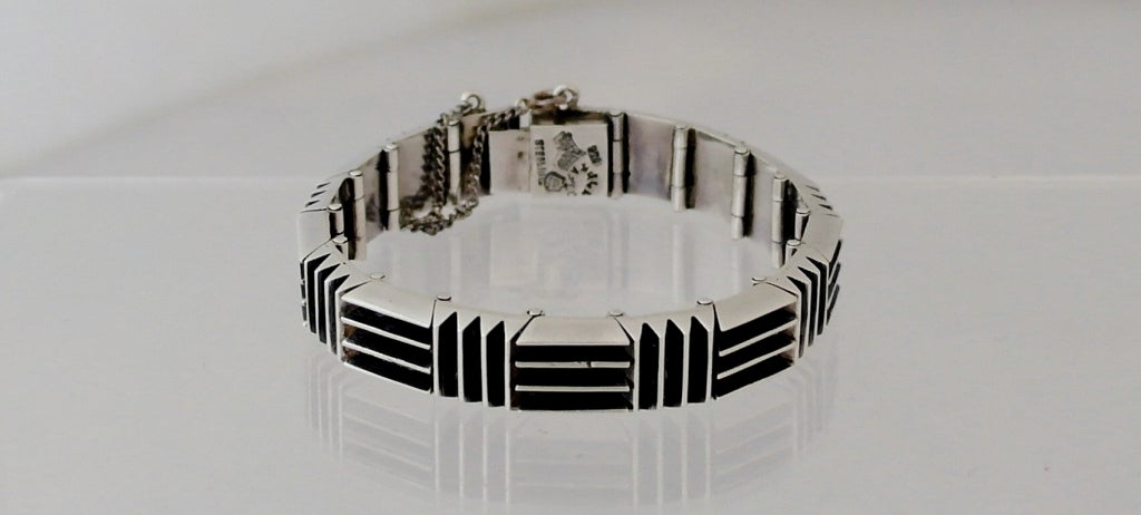 Being offered is a circa 1960 .970 silver bracelet by Antonio Pineda of Taxco, Mexico, each section of raised horizontal and vertical elevations, the links masterfully connected.  Length 6 3/4 inches, width of each link 1/2 inch.  Weight 2 1/2 ozs. 