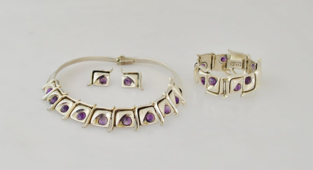 Being offered is a circa 1980s .970 silver and amethyst Pineda style parure.
