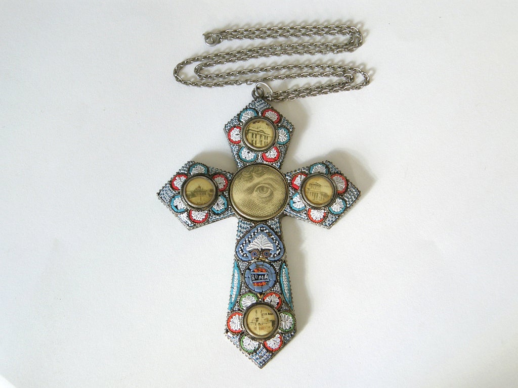 This necklace features a wonderful micromosaic pendant in the form of a cross set with images of architectural landmarks in Rome and an Eye of Providence, or All Seeing Eye of God, at the center. The dramatic design is enhanced by the