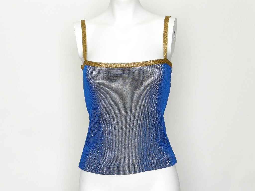 Sexy, Yves Saint Laurent metallic knit tank top in gold and blue. The two colors create a kind of electric sharkskin effect that sparkles and accentuates the curves of the wearer. No size stated, though the knit gives allowance for
