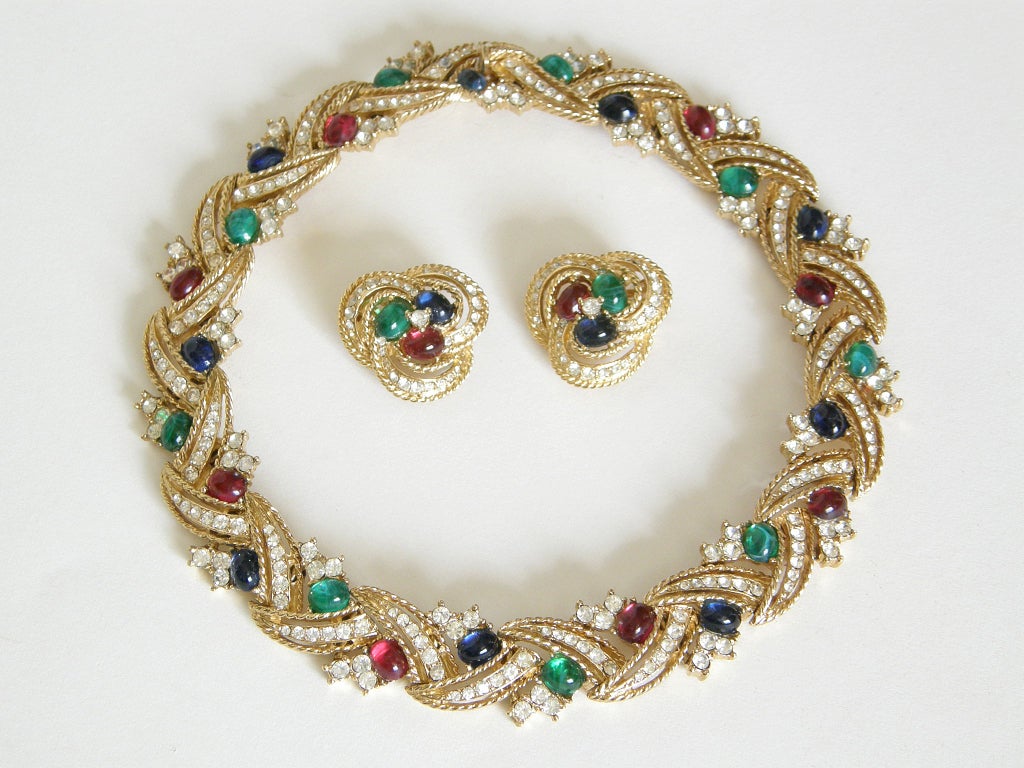Ciner necklace and earrings in goldtone metal set with clear rhinestones and faux ruby, sapphire and emerald cabochons. 

The earrings measure a bit over an inch in diameter. The necklace measures 15.25