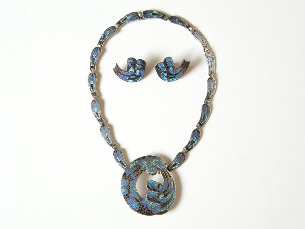 Margot de Taxco enameled sterling necklace and earring set with a curling ribbon or wave motif. The lovely enamel work has an effect like a mosaic or a stained glass window. This cleverly designed necklace can be separated into a slender choker and