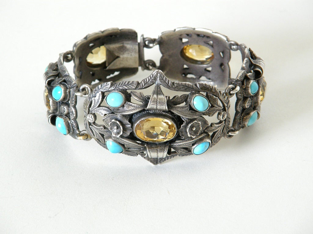 Exceptional silver link bracelet set with turquoise cabochons and faceted citrines. (Though I can tell that the turquoise is natural, I am not sure if the citrines are natural stones.) This dramatic bracelet has a wonderfully 3-dimensional