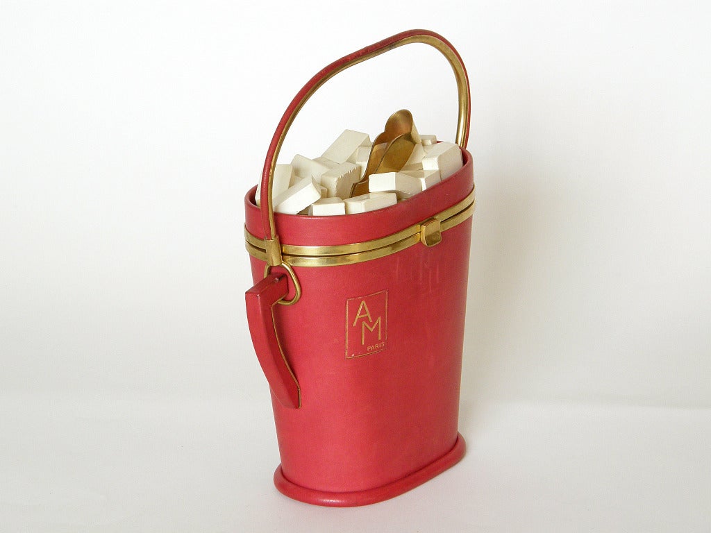 Extremely rare sugar bowl shaped handbag by Anne-Marie. The bag is covered in red leather with white painted wood sugar cubes and gold-plated tongs. The front has a label with 