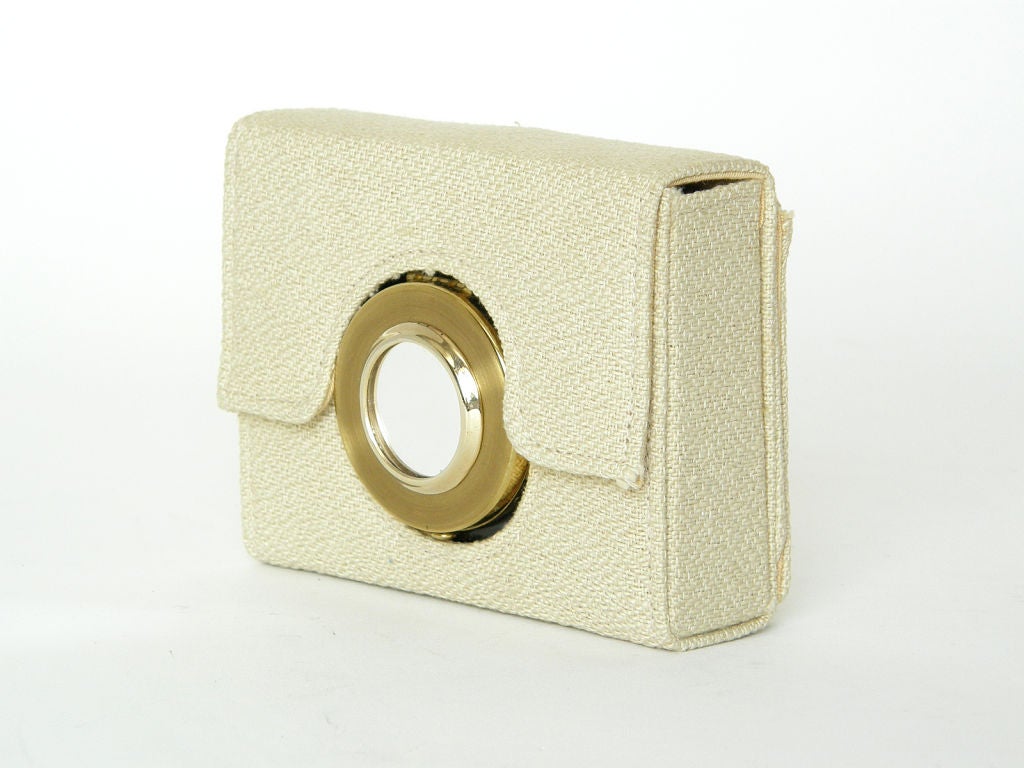 This rare, figural camera shaped minaudiere is so cleverly designed. The gold plated and enameled 